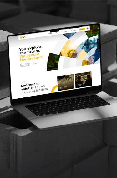 A laptop placed on a stack of bricks, showcasing a contrast between technology and construction materials.